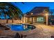 Stunning pool and backyard view at night at 1663 S Boulder St, Gilbert, AZ 85295