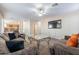 Spacious living area with hardwood floors and a large TV at 1663 S Boulder St, Gilbert, AZ 85295