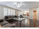 Open living room with a view to kitchen and a glass coffee table at 1663 S Boulder St, Gilbert, AZ 85295