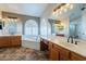 Elegant bathroom with double vanity, large soaking tub, and arched windows at 1663 S Boulder St, Gilbert, AZ 85295