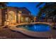 Luxury pool and backyard at night at 1663 S Boulder St, Gilbert, AZ 85295