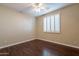 Simple bedroom with wood floors and ceiling fan at 1663 S Boulder St, Gilbert, AZ 85295