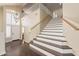 Elegant two-story entryway with hardwood floors and a grand staircase at 1663 S Boulder St, Gilbert, AZ 85295