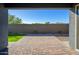 Covered patio with brick pavers and artificial turf at 735 E Marblewood Way, Phoenix, AZ 85048