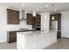 Large kitchen island with granite countertops and pendant lighting at 735 E Marblewood Way, Phoenix, AZ 85048
