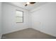 Bright bedroom with ceiling fan and sliding closet doors at 735 E Marblewood Way, Phoenix, AZ 85048