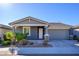 New construction home with gray exterior and two-car garage at 735 E Marblewood Way, Phoenix, AZ 85048