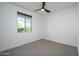 Well-lit bedroom with window and ceiling fan at 735 E Marblewood Way, Phoenix, AZ 85048