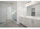 Double vanity bathroom with a walk-in shower and gray tile floors at 735 E Marblewood Way, Phoenix, AZ 85048