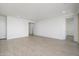 Bright and spacious living room with light wood-look tile flooring at 735 E Marblewood Way, Phoenix, AZ 85048