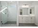 Bathroom features a walk-in shower, double vanity, and gray tile floors at 735 E Marblewood Way, Phoenix, AZ 85048