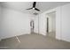 Bedroom with ceiling fan and access to bathroom and closet at 735 E Marblewood Way, Phoenix, AZ 85048