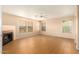 Large bedroom with wood floors, fireplace and ceiling fan at 25575 W Lynne Ln, Buckeye, AZ 85326