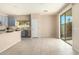 Kitchen boasts blue cabinets, marble countertops, and stainless steel appliances at 25575 W Lynne Ln, Buckeye, AZ 85326