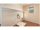 Bright laundry room with built-in shelving and a drain at 25575 W Lynne Ln, Buckeye, AZ 85326
