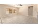 Spacious living room featuring tile floors and a ceiling fan at 25575 W Lynne Ln, Buckeye, AZ 85326
