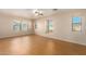 Bedroom with wood-look floors, ceiling fan and multiple windows at 25575 W Lynne Ln, Buckeye, AZ 85326