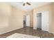 Bedroom with wood-look floors, ceiling fan and spacious closet at 25575 W Lynne Ln, Buckeye, AZ 85326