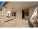 Covered patio with sliding glass doors leading to the interior at 25575 W Lynne Ln, Buckeye, AZ 85326
