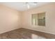 Bedroom with wood flooring and ceiling fan at 25575 W Lynne Ln, Buckeye, AZ 85326