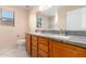 Double vanity bathroom with granite countertop at 25575 W Lynne Ln, Buckeye, AZ 85326