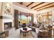 Comfortable living room with fireplace and access to patio at 27440 N Alma School Pkwy # 116, Scottsdale, AZ 85262