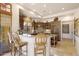 Island kitchen with granite counters and breakfast bar at 27440 N Alma School Pkwy # 116, Scottsdale, AZ 85262
