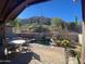 Relaxing backyard patio with a spa, seating area, and mountain views at 27440 N Alma School Pkwy # 116, Scottsdale, AZ 85262