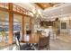 Elegant dining area with wood table and kitchen views at 27440 N Alma School Pkwy # 116, Scottsdale, AZ 85262