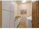 Bright laundry room with white cabinets and washer/dryer at 27440 N Alma School Pkwy # 116, Scottsdale, AZ 85262