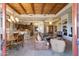 Open living room and kitchen with high ceilings and wood beams at 27440 N Alma School Pkwy # 116, Scottsdale, AZ 85262
