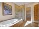 Luxurious bathroom with soaking tub, walk-in shower, and separate closet at 27440 N Alma School Pkwy # 116, Scottsdale, AZ 85262