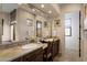 Double vanity bathroom with access to a separate room at 27440 N Alma School Pkwy # 116, Scottsdale, AZ 85262