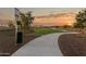 Paved pathway beside dog park with waste disposal at 25383 W Sunland Ave, Buckeye, AZ 85326