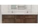 Double vanity bathroom with white quartz countertops and modern faucets at 25383 W Sunland Ave, Buckeye, AZ 85326