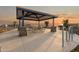 Outdoor community pavilion with picnic tables, grills, and bike rack at 25383 W Sunland Ave, Buckeye, AZ 85326