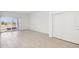 Spacious bedroom with sliding door and tile floor at 25383 W Sunland Ave, Buckeye, AZ 85326