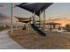 Modern playground with climbing structures and slide at 25383 W Sunland Ave, Buckeye, AZ 85326