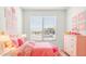 Charming bedroom with pink accents and floral bedding at 25383 W Sunland Ave, Buckeye, AZ 85326