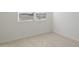 Bright bedroom with neutral walls and tile flooring at 25383 W Sunland Ave, Buckeye, AZ 85326