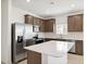 Modern kitchen with stainless steel appliances and an island at 25383 W Sunland Ave, Buckeye, AZ 85326