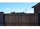 Wooden gate with black metal frame at 3722 E Haflinger Rd, San Tan Valley, AZ 85140