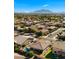 Aerial view of a residential neighborhood with houses, streets, and a pool visible at 1138 E Regent Dr, Gilbert, AZ 85298