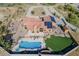 An aerial view of a home with a pool, solar panels, and desert landscaping at 38820 N 19Th Way, Phoenix, AZ 85086