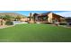 Backyard with a pool, artificial turf lawn, and mountain view at 38820 N 19Th Way, Phoenix, AZ 85086