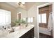 Bathroom with double sinks, large mirror, and neutral decor at 38820 N 19Th Way, Phoenix, AZ 85086