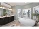 Stunning bathroom with double vanities, soaking tub, and natural light at 38820 N 19Th Way, Phoenix, AZ 85086