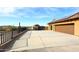 Concrete driveway leading to a two-car garage with a gated entry at 38820 N 19Th Way, Phoenix, AZ 85086