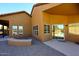 View of home's exterior and backyard access from patio at 38820 N 19Th Way, Phoenix, AZ 85086