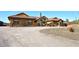 Exterior view of a Southwestern style home with tile roof and desert landscaping at 38820 N 19Th Way, Phoenix, AZ 85086